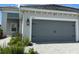 Spacious two-car garage with stone paver driveway at 2918 Butterfly Jasmine Trl, Sarasota, FL 34240