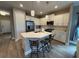Modern kitchen boasts white cabinetry, quartz countertops, and stainless steel appliances at 2918 Butterfly Jasmine Trl, Sarasota, FL 34240