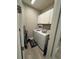 Laundry room featuring a front loading washer and dryer, and white cabinets at 2918 Butterfly Jasmine Trl, Sarasota, FL 34240