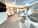 Open living space with kitchen, dining area and living room with high ceilings at 2918 Butterfly Jasmine Trl, Sarasota, FL 34240
