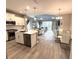 Bright open floorplan seamlessly connects the kitchen, dining area, and living room at 2918 Butterfly Jasmine Trl, Sarasota, FL 34240