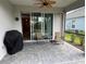 Relaxing screened patio featuring brick flooring, comfortable seating, and a ceiling fan at 2918 Butterfly Jasmine Trl, Sarasota, FL 34240