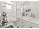 Bathroom with double vanity, shower over tub, and neutral color palette at 296 Treasure Boat Way, Sarasota, FL 34242