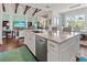 Open kitchen with a large island and adjacent Gathering room for seamless entertaining at 296 Treasure Boat Way, Sarasota, FL 34242