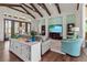 Bright living room with wood floors, beamed ceilings, and comfortable seating at 296 Treasure Boat Way, Sarasota, FL 34242