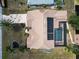 High angle aerial view shows backyard with pool and spa, boat dock, and tile roof at 3069 Stone St, Port Charlotte, FL 33981