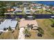 Expansive aerial view shows a single Gathering home with canal access near other waterfront homes at 3069 Stone St, Port Charlotte, FL 33981