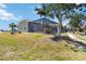 Home with a screened-in porch and backyard perfect for entertaining or relaxing near the water at 3069 Stone St, Port Charlotte, FL 33981