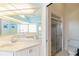 Bright bathroom boasts double sinks, large mirror, and walk-in shower at 3069 Stone St, Port Charlotte, FL 33981