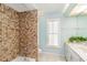 Bathroom with mosaic tiled shower and white sink at 3069 Stone St, Port Charlotte, FL 33981
