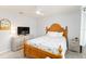 Cozy bedroom features wood-framed bed and light colored dressers at 3069 Stone St, Port Charlotte, FL 33981