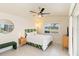 Bedroom boasts a bed with tropical headboard and a ceiling fan at 3069 Stone St, Port Charlotte, FL 33981
