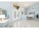 Inviting entryway featuring a decorative mirror and a glimpse of the dining area at 3069 Stone St, Port Charlotte, FL 33981