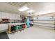 Organized garage space featuring ample storage, workbench area, and clean flooring for versatile use at 3069 Stone St, Port Charlotte, FL 33981