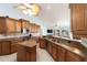 Open kitchen features ample counter space, stainless steel appliances, and easy access to the living area with scenic view at 3069 Stone St, Port Charlotte, FL 33981