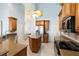 Well-appointed kitchen features stainless appliances, center island, and seamless flow to adjacent living spaces for easy entertaining at 3069 Stone St, Port Charlotte, FL 33981