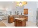 Spacious kitchen offers a center island, tile flooring, and seamless flow to the living and dining areas at 3069 Stone St, Port Charlotte, FL 33981