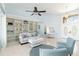 Bright living room with built-in shelving, light blue walls, and coastal decor at 3069 Stone St, Port Charlotte, FL 33981