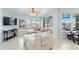A living room features neutral colors, tile floors and views of the outdoors at 3069 Stone St, Port Charlotte, FL 33981