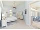 Airy main bedroom with high ceilings and access to an outdoor seating area at 3069 Stone St, Port Charlotte, FL 33981