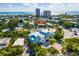 Aerial view of a house in a coastal neighborhood with mature trees and a swimming pool at 336 Avenida De Mayo, Sarasota, FL 34242