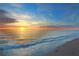 Calm beach view as waves roll in, and the sun sets over the water at 336 Avenida De Mayo, Sarasota, FL 34242