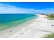 Aerial beach view with glistening turquoise waters, white sand and sunny clear skies at 336 Avenida De Mayo, Sarasota, FL 34242