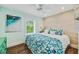 Stylish bedroom featuring wood flooring and a bright window, creating a tranquil retreat at 336 Avenida De Mayo, Sarasota, FL 34242