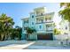 Beautiful three-story home with a two-car garage and multiple balconies with ocean themed decor at 336 Avenida De Mayo, Sarasota, FL 34242