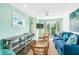 Bright living room features a coastal design, wicker furniture, and a large sliding glass door at 336 Avenida De Mayo, Sarasota, FL 34242