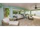Cozy outdoor seating area with multiple sofas and chairs underneath a covered patio at 336 Avenida De Mayo, Sarasota, FL 34242