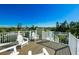 Rooftop deck with comfortable seating offers panoramic views for ultimate relaxation and enjoyment at 336 Avenida De Mayo, Sarasota, FL 34242