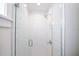 Modern shower boasts a glass door, white subway tiles, and chrome fixtures at 336 Avenida De Mayo, Sarasota, FL 34242