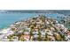 Beautiful neighborhood near the water, with a home featuring a pool and tropical landscaping at 3455 Flamingo Ave, Sarasota, FL 34242