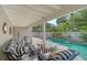 A beautiful outdoor patio featuring cushioned seating, lounge chairs and a private swimming pool at 3455 Flamingo Ave, Sarasota, FL 34242