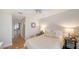 Comfortable bedroom featuring hardwood floors, neutral decor, and a ceiling fan at 3455 Flamingo Ave, Sarasota, FL 34242