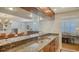 Modern kitchen with stainless steel appliances, granite countertop, and view to dining area at 3455 Flamingo Ave, Sarasota, FL 34242