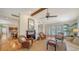 Cozy living room with a fireplace, hardwood floors, and large french doors for natural light at 3455 Flamingo Ave, Sarasota, FL 34242