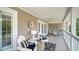 Inviting outdoor patio with comfortable seating, a ceiling fan, and tasteful nautical decor at 3455 Flamingo Ave, Sarasota, FL 34242