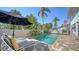Inviting pool with lounge chairs and tropical landscaping at 3455 Flamingo Ave, Sarasota, FL 34242