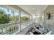 Relaxing porch view overlooking the landscaped yard with views of the water at 3455 Flamingo Ave, Sarasota, FL 34242