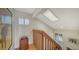 Bright stairwell area with hardwood floors, natural light and wooden railing at 3455 Flamingo Ave, Sarasota, FL 34242