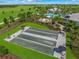 Bocce ball courts sit beside a pool area at this amazing new community, surrounded by manicured landscaping at 3568 Santa Caterina Blvd, Bradenton, FL 34211