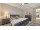 Tastefully decorated bedroom with ceiling fan, plush rug, and elegant gray furniture set at 3568 Santa Caterina Blvd, Bradenton, FL 34211