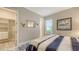 Comfortable bedroom featuring a patterned rug, walk-in closet and bright natural light at 3568 Santa Caterina Blvd, Bradenton, FL 34211