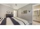 Bedroom with a spacious interior design that leads into a bathroom and hallway at 3568 Santa Caterina Blvd, Bradenton, FL 34211