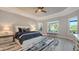 Serene bedroom with natural light, tray ceiling, and views of the golf course at 3568 Santa Caterina Blvd, Bradenton, FL 34211