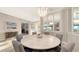 Elegant dining room with decorative light fixture, leads to office at 3568 Santa Caterina Blvd, Bradenton, FL 34211