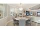 Dining area featuring a stylish chandelier and mirror wall at 3568 Santa Caterina Blvd, Bradenton, FL 34211