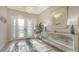 Bright and airy foyer featuring a decorative mirror and an ornate door with sidelights at 3568 Santa Caterina Blvd, Bradenton, FL 34211